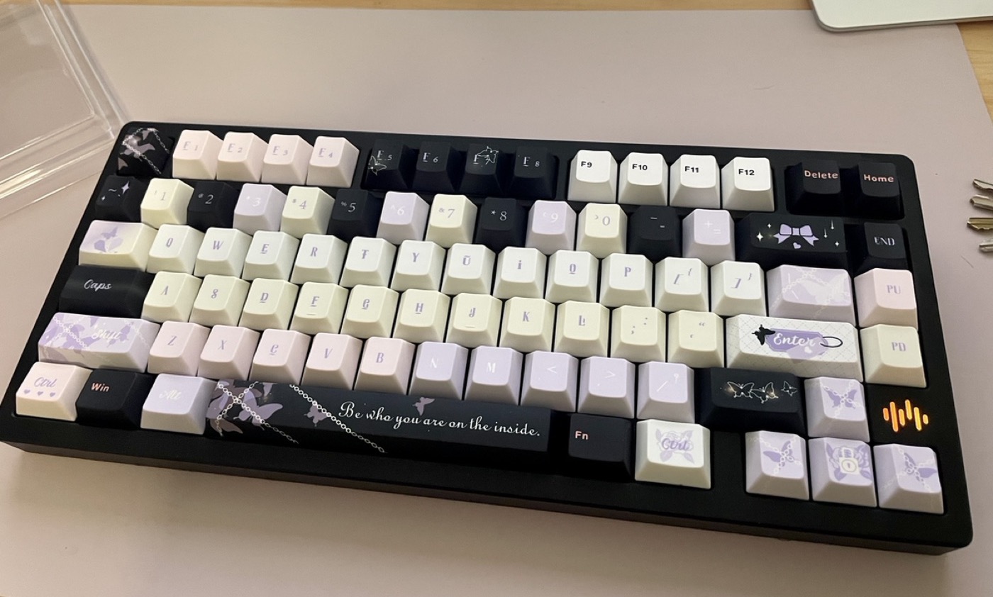 Lilac butterfly themed keyboard shown from above