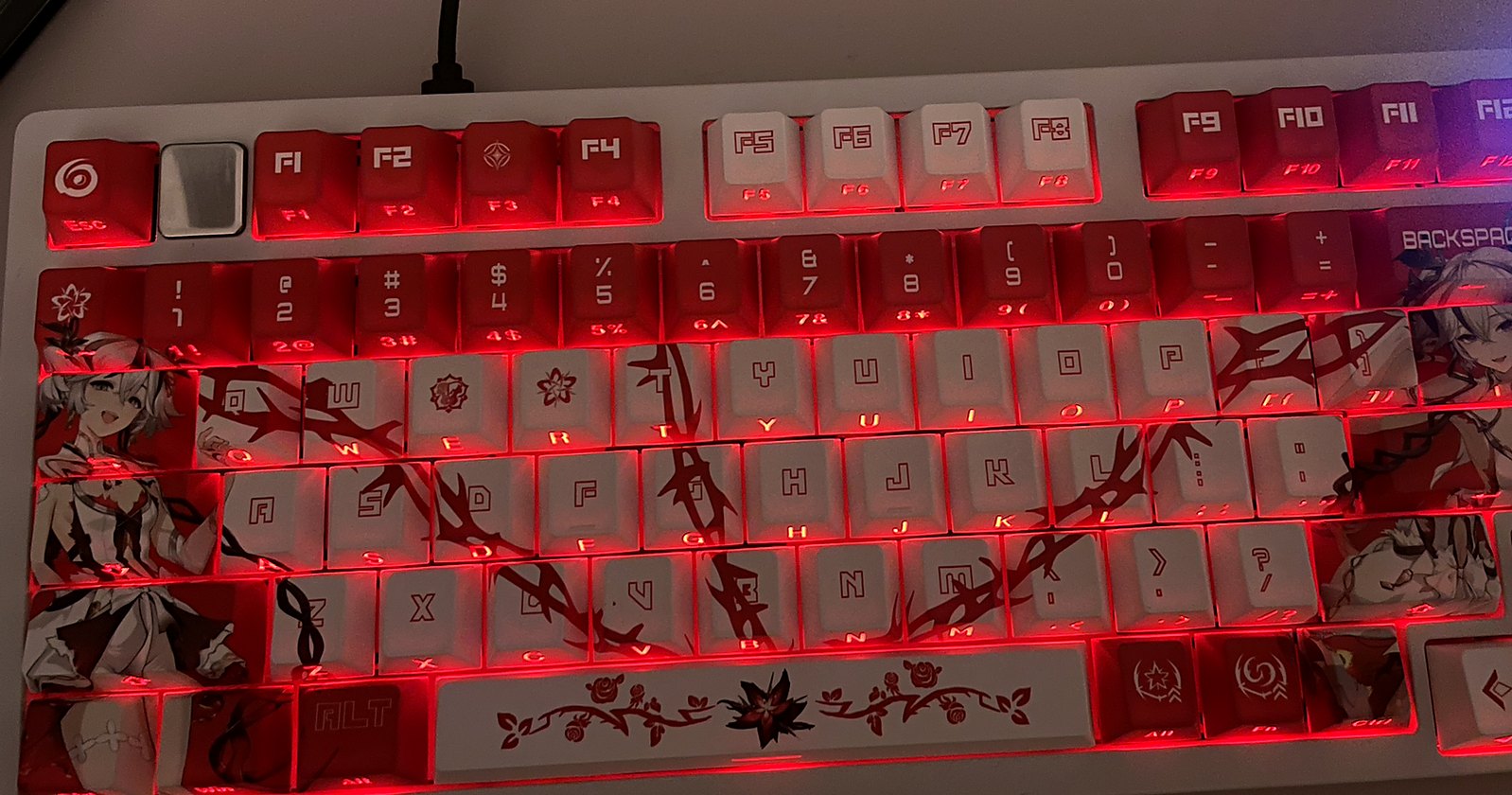 Close-up of red artwork keycaps with RGB lighting