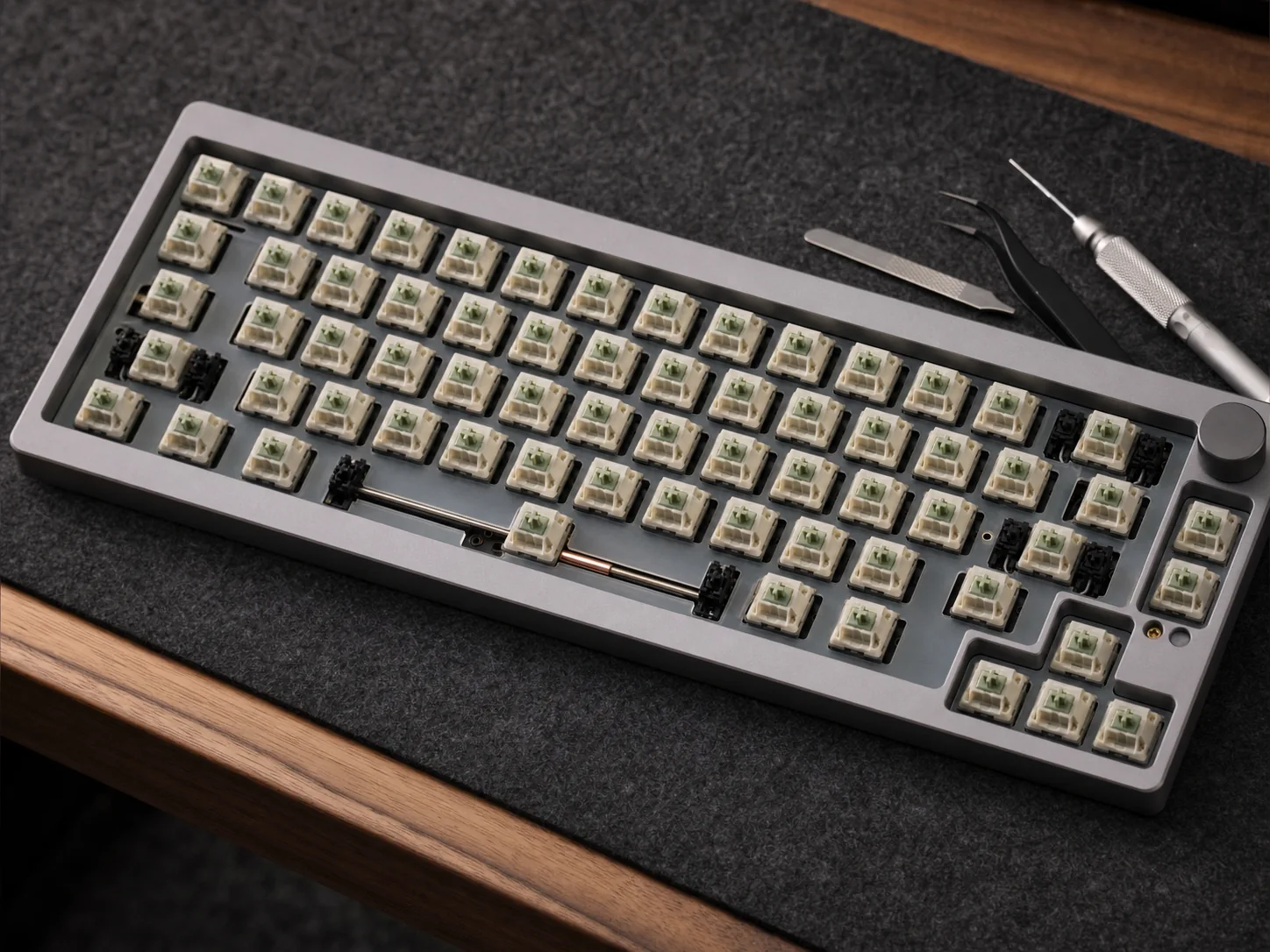 Aluminium keyboard with switches and precision tools prepared for assembly and tuning