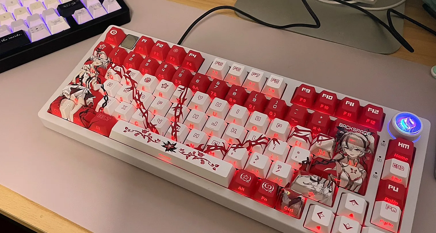Red and white custom artwork keyboard on a desk