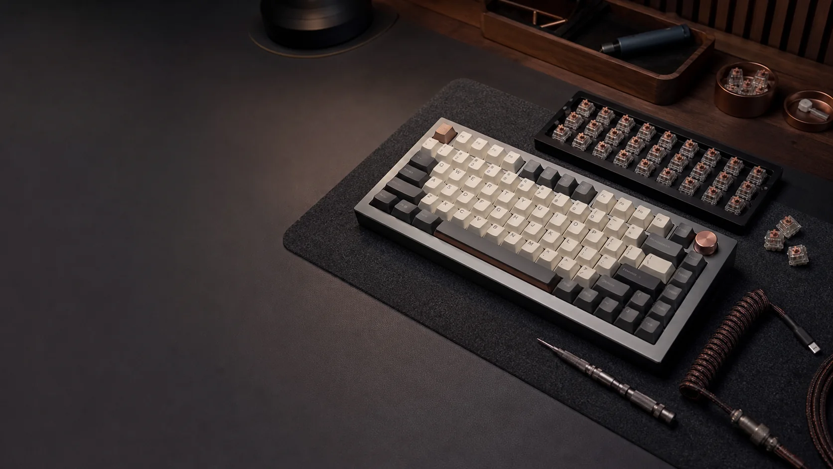 Premium aluminium keyboard and components arranged in a custom build studio